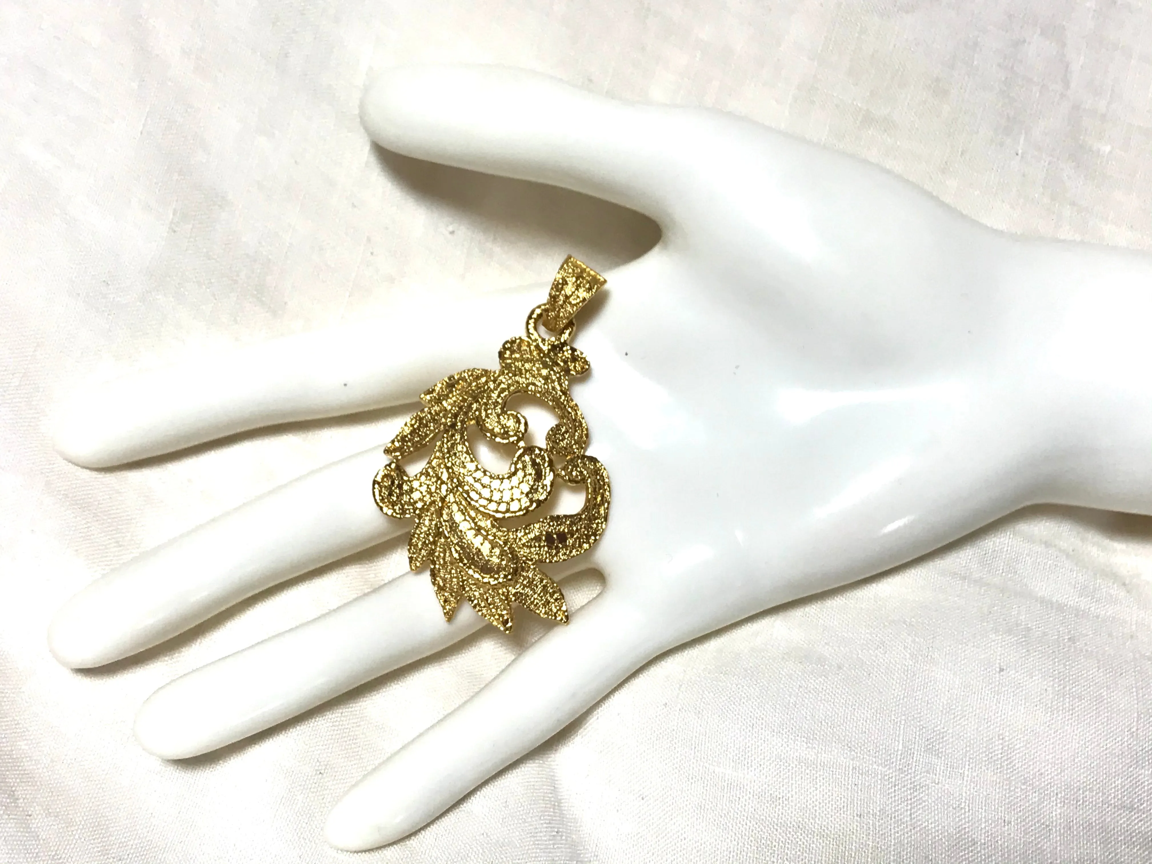 MINT. Vintage Yves Saint Laurent golden arabesque design pendant top. YSL leaf design top. Enjoy it with your own necklace. 061105re4
