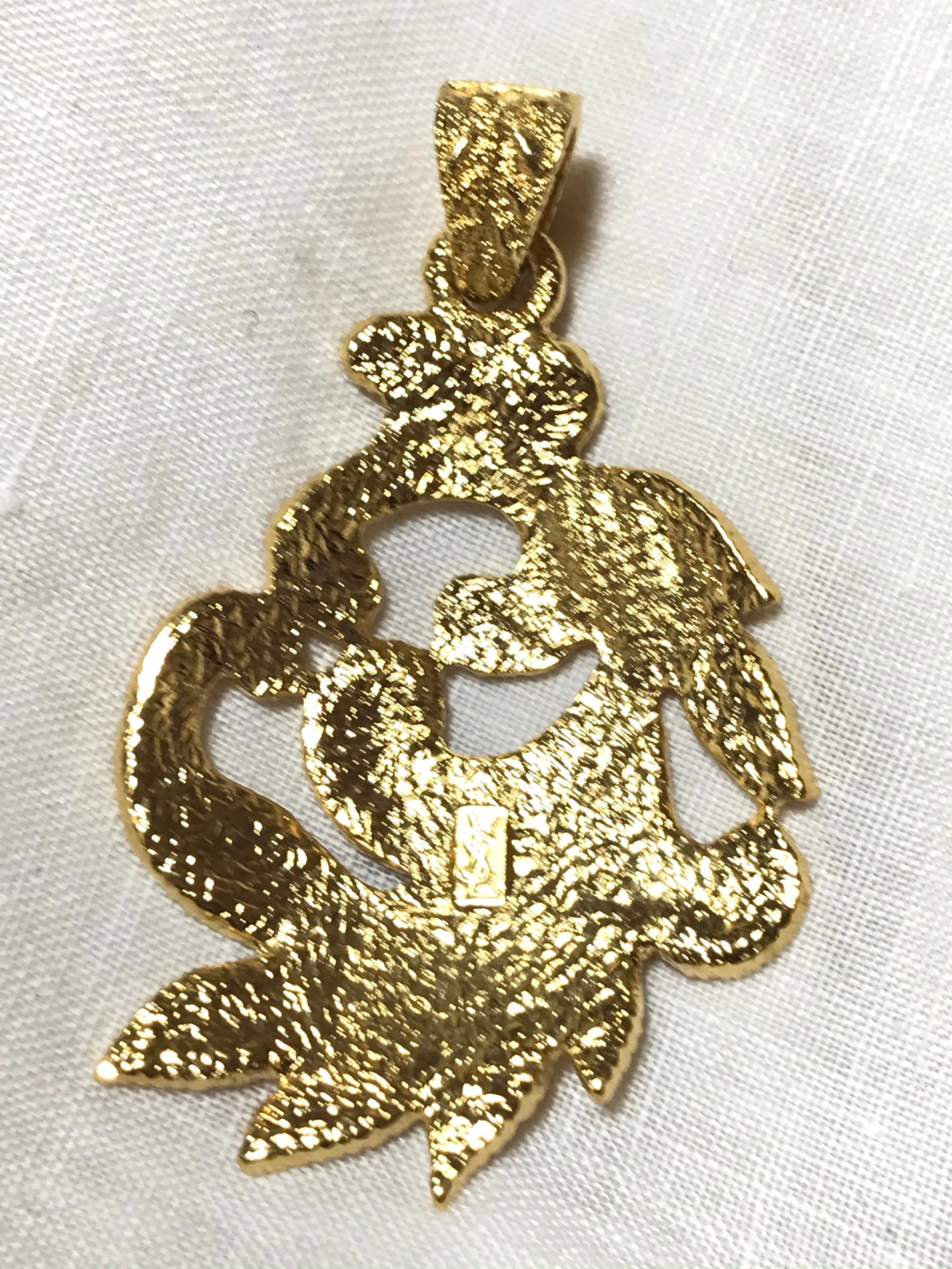 MINT. Vintage Yves Saint Laurent golden arabesque design pendant top. YSL leaf design top. Enjoy it with your own necklace. 061105re4