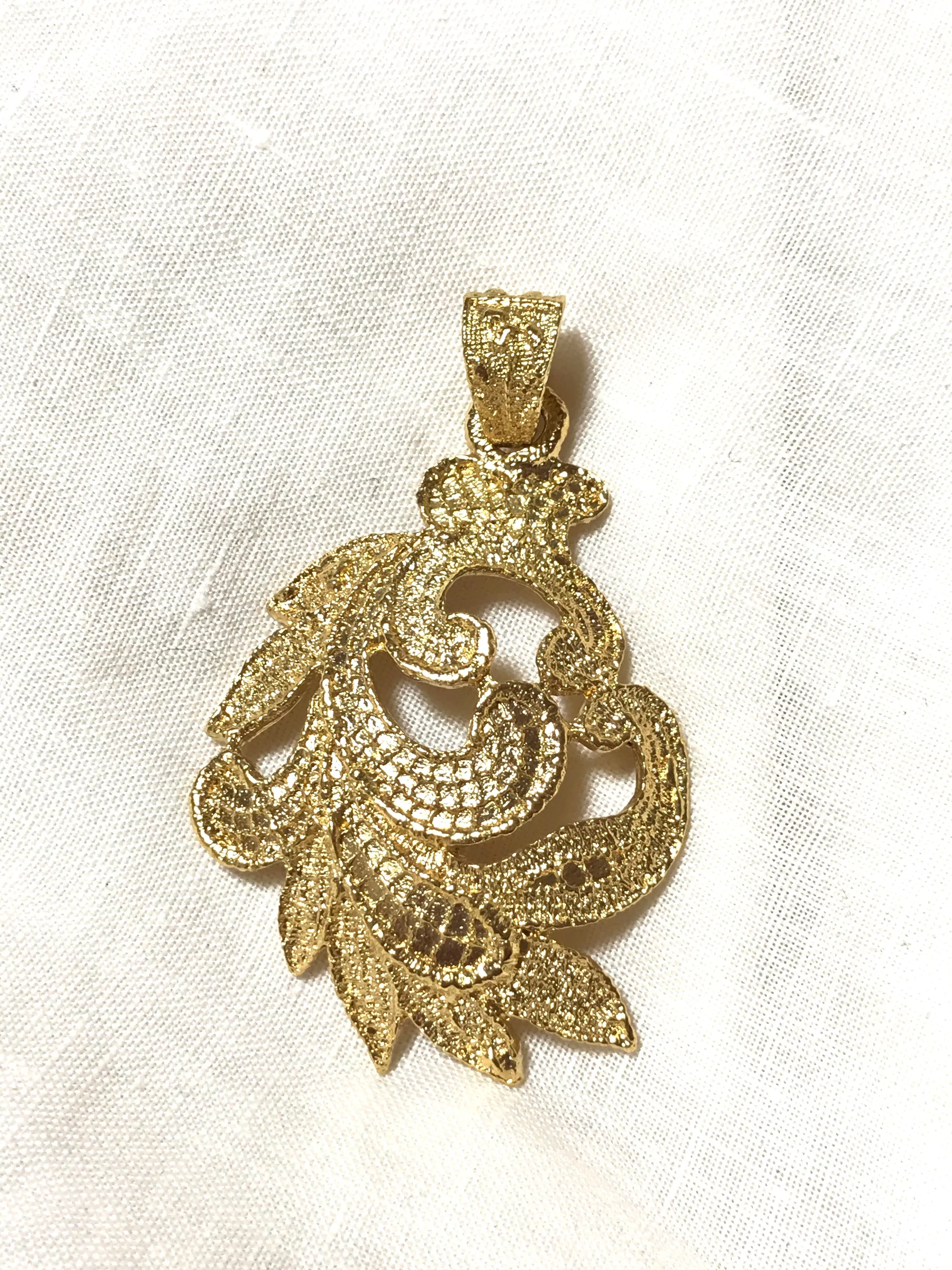 MINT. Vintage Yves Saint Laurent golden arabesque design pendant top. YSL leaf design top. Enjoy it with your own necklace. 061105re4