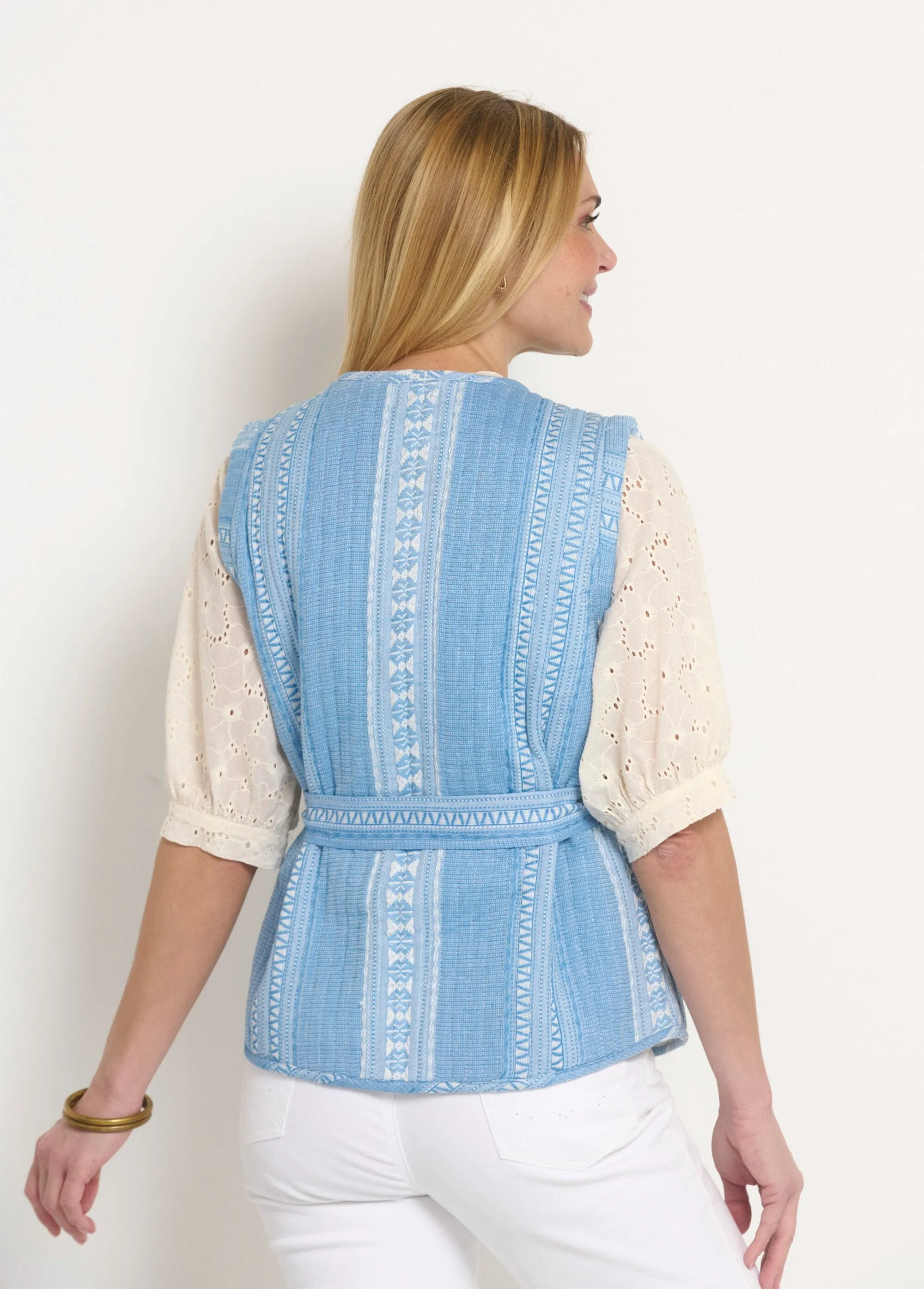 Sleeveless quilted jacket with rhinestone details