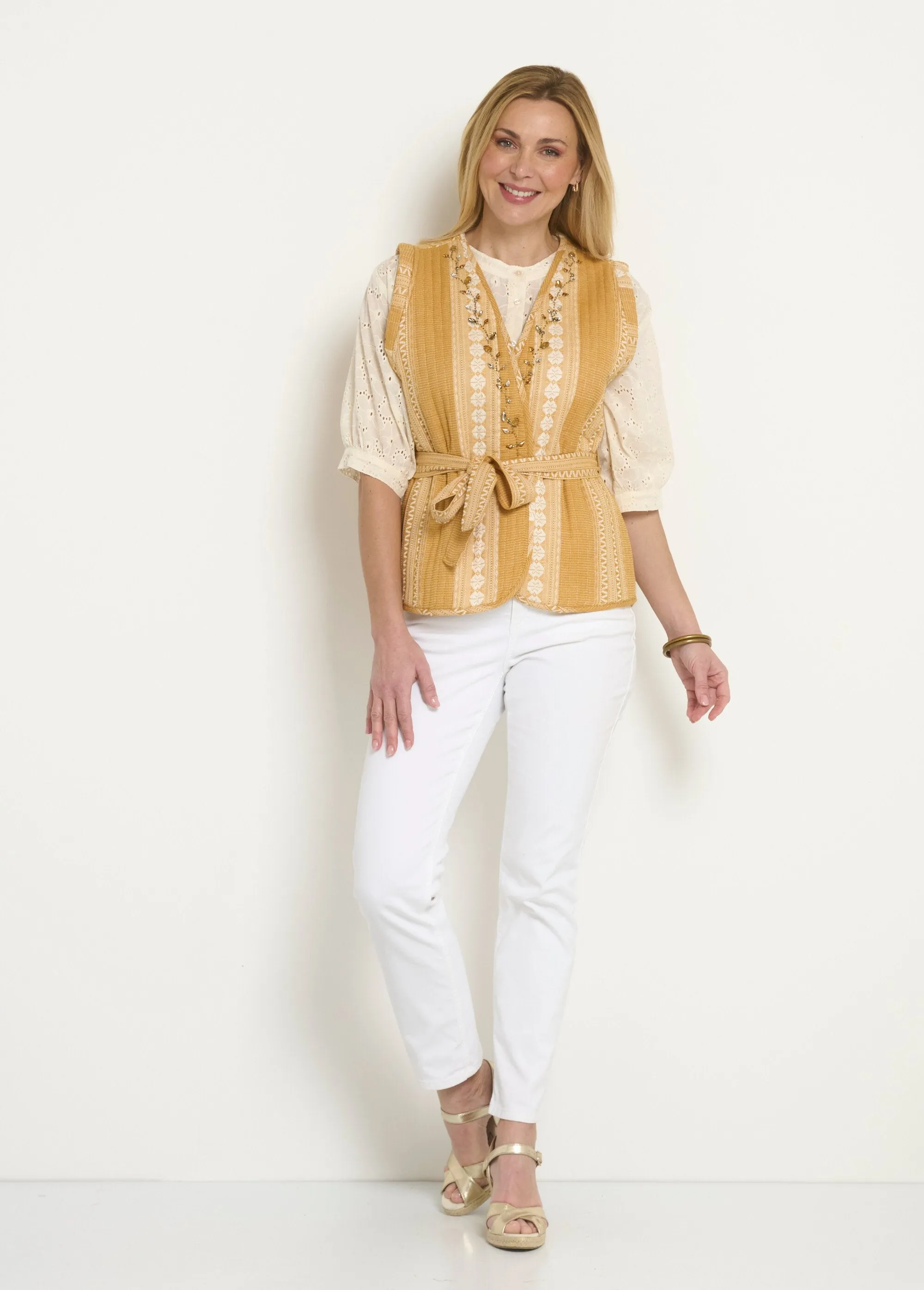 Sleeveless quilted jacket with rhinestone details
